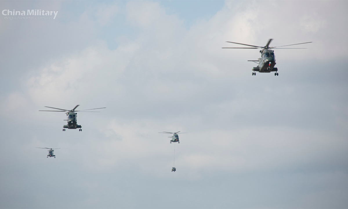 Helicopters attached to a brigade with the army under the PLA Southern Theater Command head to the designated area during a training exercise in mid-September, 2022. Photo:China Military