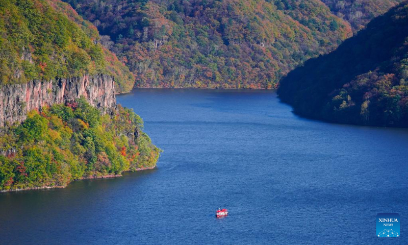 A ship sails on Baishan Lake of the Hongshi National Forest Park in Jilin City, northeast China's Jilin Province, Oct. 5, 2022. (Xinhua/Yan Linyun)