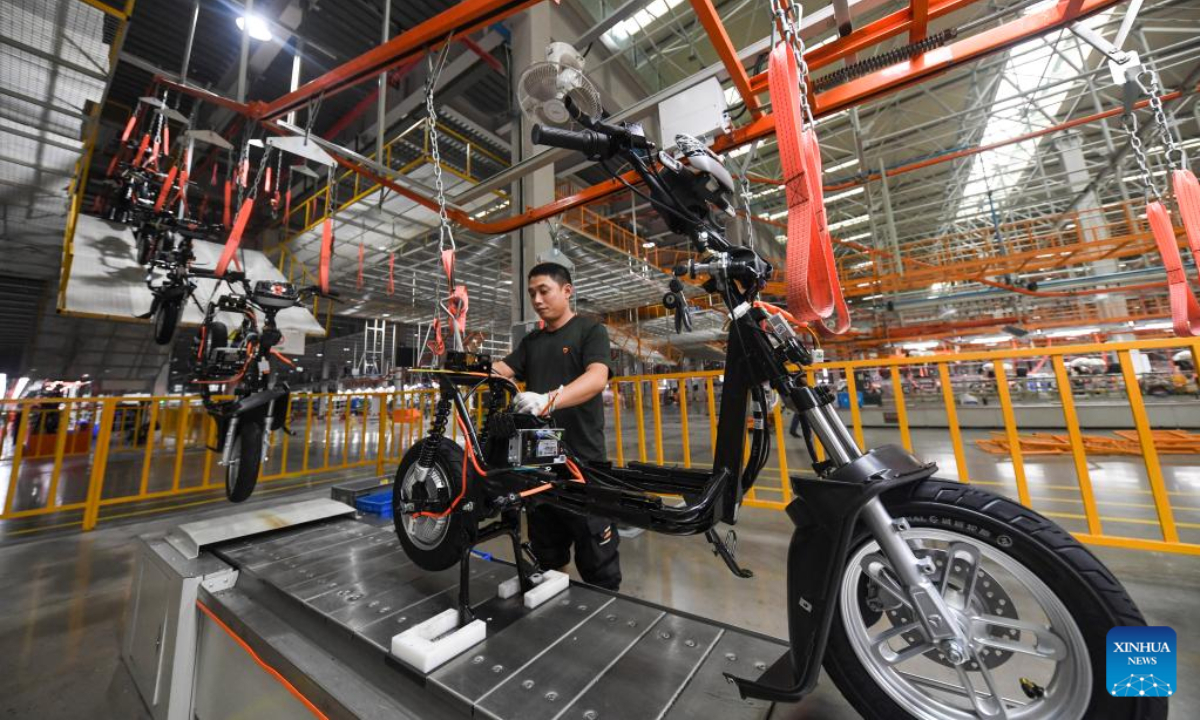 A worker works at Yadea Group's intelligent production base of electric scooters in Yongchuan District of southwest China's Chongqing, Sep 22, 2022. Photo:Xinhua
