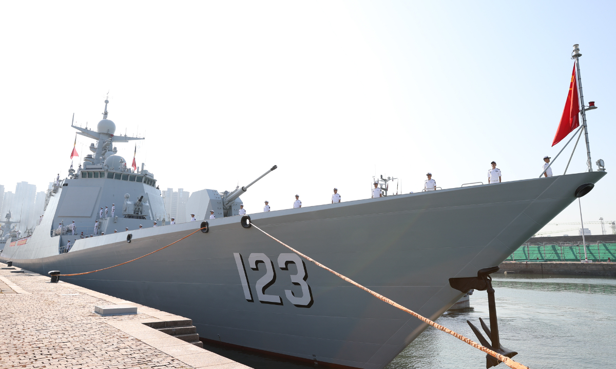 Guided-missile destroyer Huainan (Hull No. 123) attached to the navy under the PLA Northern Theater Command berths at a military port in Qingdao, east China's Shandong Province on September 21, 2022. The 42nd Chinese naval escort taskforce composed of the guided-missile destroyer Huainan, the guided-missile frigate Rizhao and the supply ship Kekexilihu sets sail from Qingdao for escort missions in the Gulf of Aden and the waters off Somalia on September 21, 2022. (Photo by Ma Yubin)