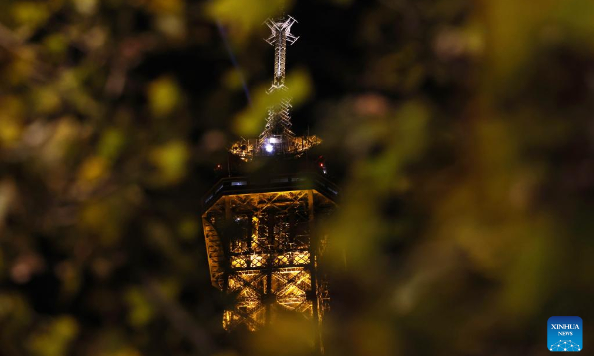 The lighting Eiffel Tower is seen in Paris, France, Sep 22, 2022. Lights will be switched off at the Eiffel Tower at 23:45, as soon as the last tourist leaves, instead of the current 1:00 from Sep 23 in order to help save energy. Photo:Xinhua