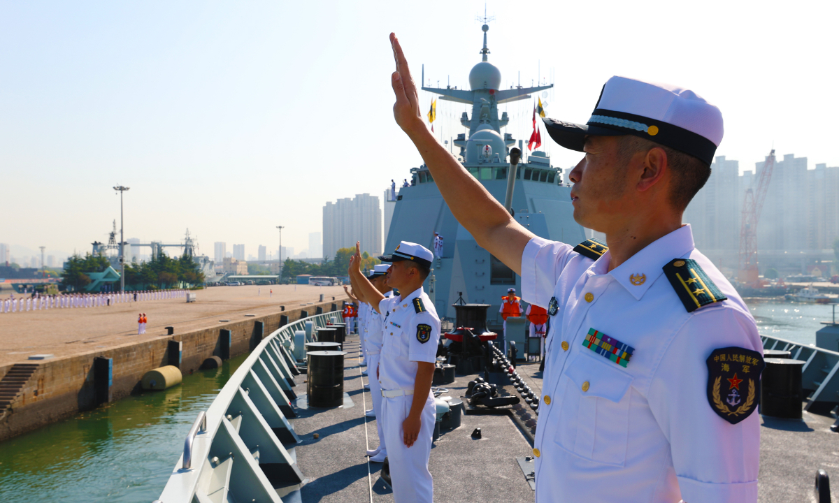 Sailors assigned to the 42nd Chinese naval escort taskforce wave goodbye to their comrade-in-arms and set off for escort missions in the Gulf of Aden and the waters off Somalia, after a farewell ceremony held at a military port in Qingdao, east China's Shandong Province on September 21, 2022. (Photo by Ma Yubin)