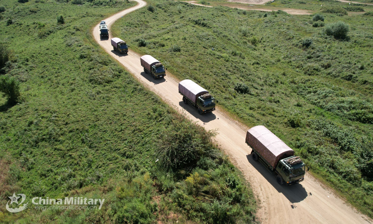 A convoy of military vehicles attached to a brigade under the PLA 78th Group Army drive in formation during an integrated support exercise on September 6, 2022. Photo: China Military