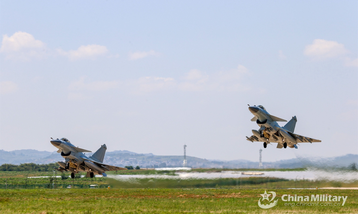 Two fighter jets attached to an aviation brigade under the PLA Southern Theater Command take off and soar into the sky during a flight training exercise on September 8, 2022. Photo:China Military