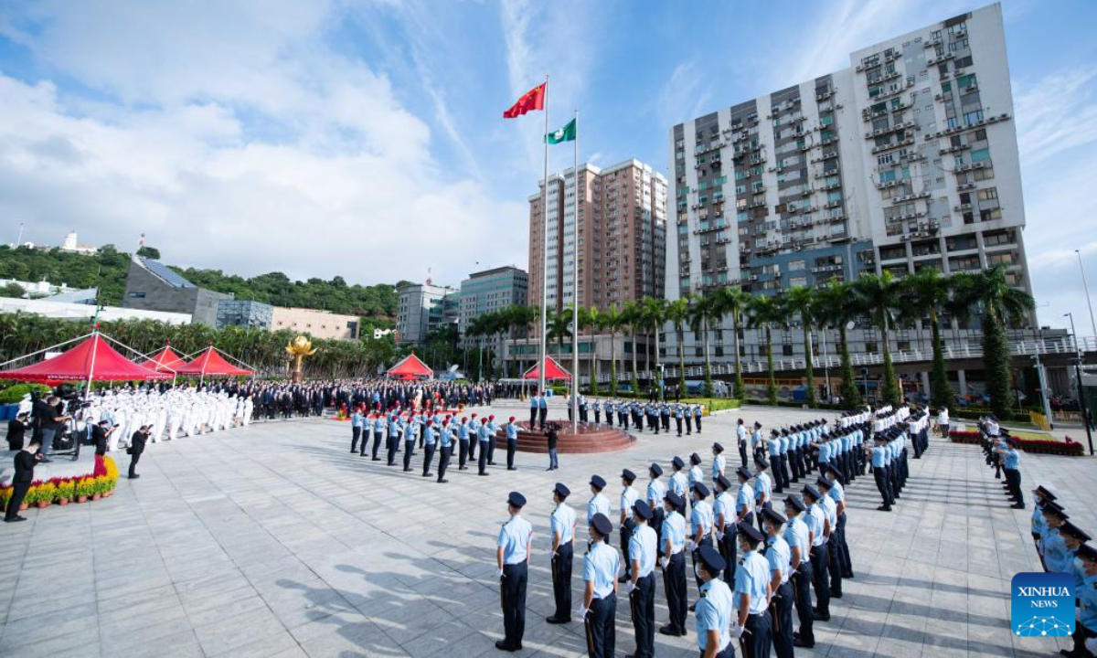 A flag-raising ceremony is held to celebrate the 73rd anniversary of the founding of the People's Republic of China at the Golden Lotus Square in Macao, south China, Oct 1, 2022. Photo:Xinhua
