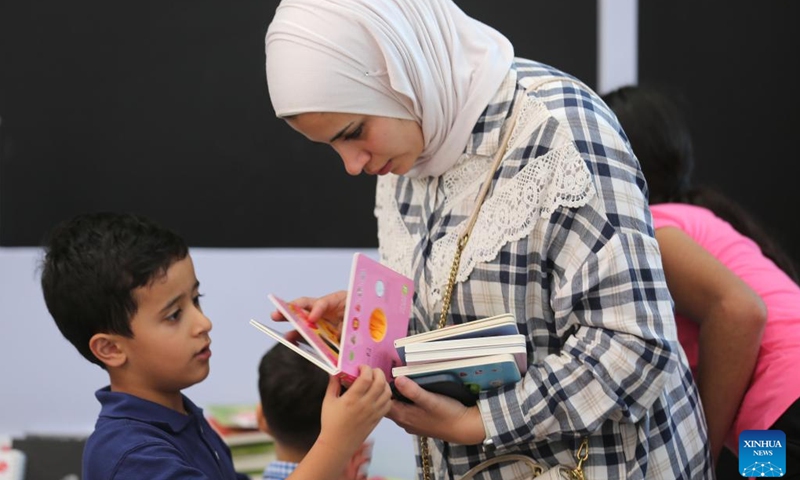 Palestinians visit the 12th edition of Palestine International Book Fair in Surda town, near the West Bank city of Ramallah, on Sept. 22, 2022.(Photo: Xinhua)