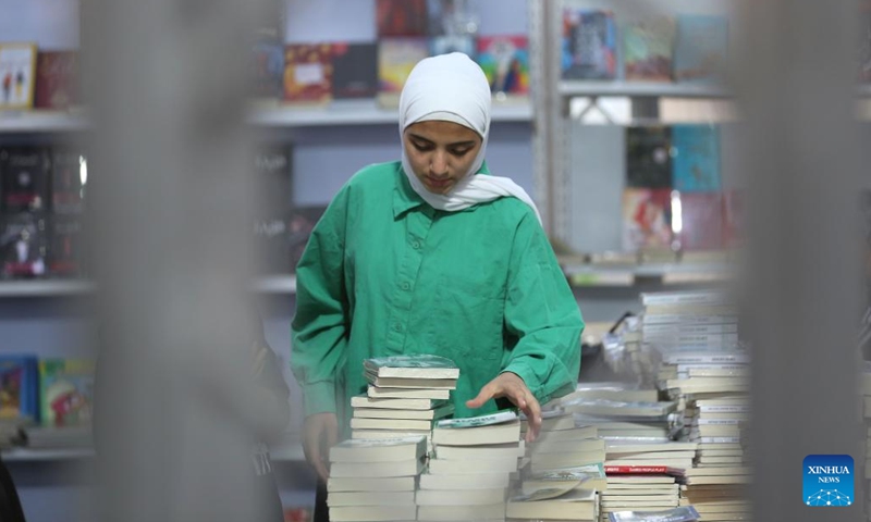 A Palestinian visits the 12th edition of Palestine International Book Fair in Surda town, near the West Bank city of Ramallah, on Sept. 22, 2022.(Photo: Xinhua)