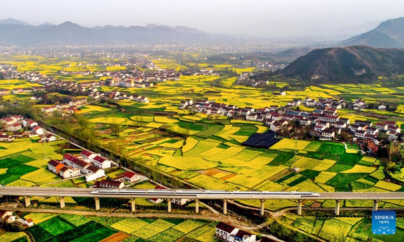 Aerial photo taken on March 21, 2018 shows cole flowers at Xinji Town of Hanzhong City, northwest China's Shaanxi Province. In recent years, Hanzhong city has been making persistent efforts to improve local ecological environment.(Photo: Xinhua)