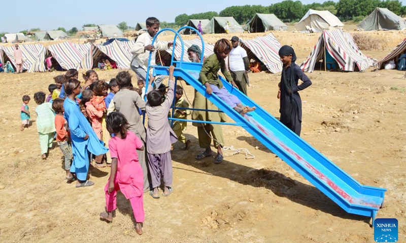 Flood-affected children play on the outskirts of southern Pakistan's Hyderabad on Sept. 24, 2022.Photo:Xinhua
