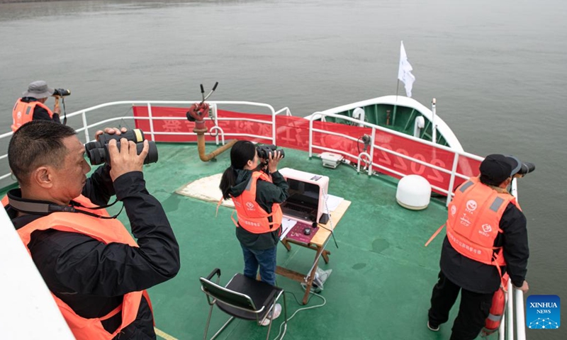 Researchers use binoculars to conduct monitoring work during a scientific expedition on Yangtze finless porpoises at the Shishou section of the Yangtze River, central China's Hubei Province, Sept. 23, 2022.Photo:xinhua