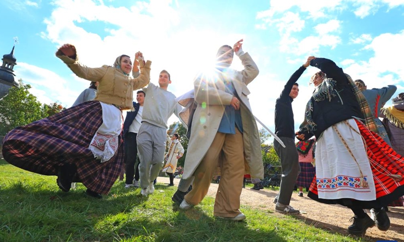 People attend a celebration of a bumper harvest in the suburb of Minsk, Belarus, Sept. 25, 2022.Photo:Xinhua