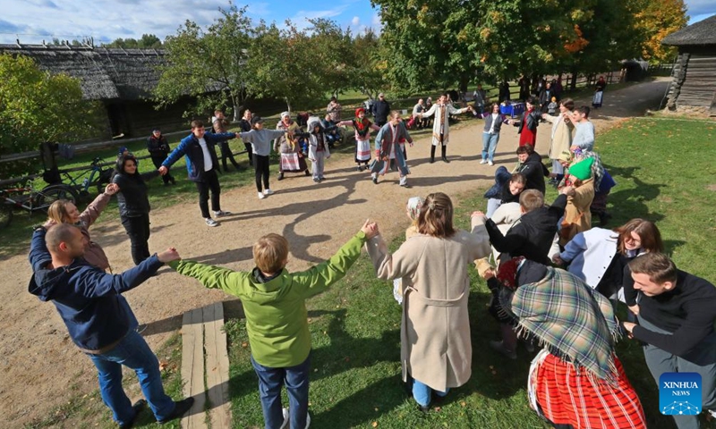 People attend a celebration of a bumper harvest in the suburb of Minsk, Belarus, Sept. 25, 2022.Photo:Xinhua