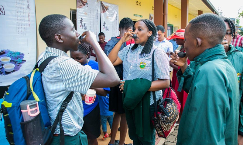 Local students taste Chinese tea while visiting Chinese cultural exhibitions organized by the Confucius Institute at the University of Rwanda's College of Education, Remera campus, in Kigali, Rwanda, Sept. 23, 2022.Photo:Xinhua