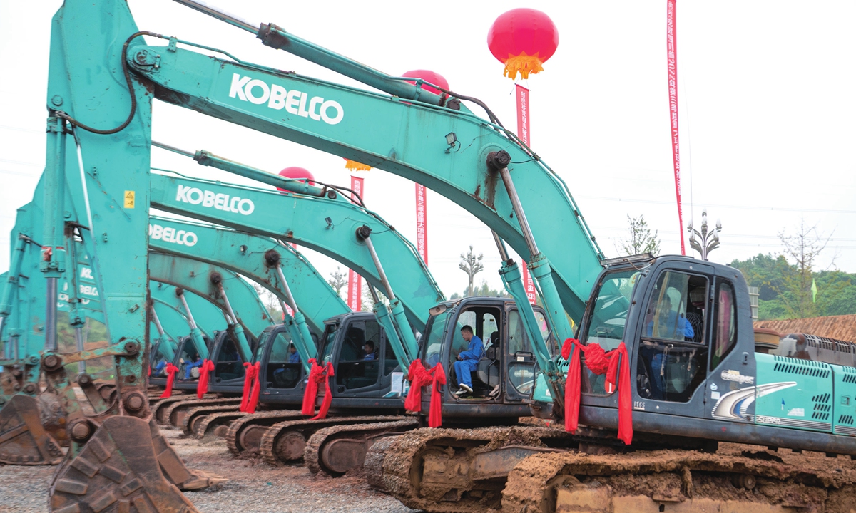 Excavators are lined up at a ceremony for the launch of major construction projects in Meishan, Southwest China's Sichuan Province on September 26, 2022. Sichuan launched 219 projects with a total investment of 595.63 billion yuan ($82.37 billion), including 10 high-speed railways projects. Photo: VCG