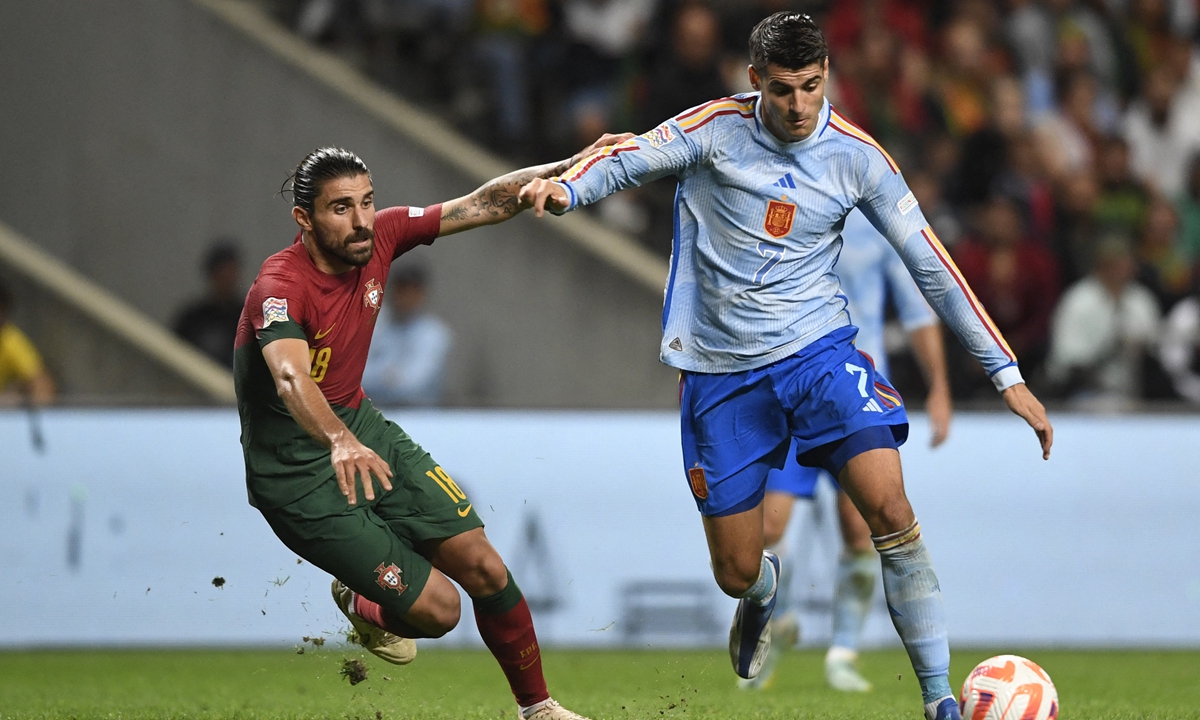 Spain's forward Alvaro Morata (right) vies with Portugal's midfielder Ruben Neves during the UEFA Nations League, League A, Group 2 soccer match between Spain and Portugal, at the Municipal Stadium in Braga, Portugal on September 27, 2022. Photo: AFP