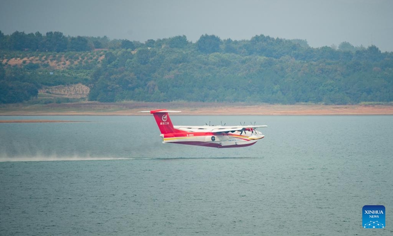 An AG600M firefighting aircraft takes off from water during a gathering and dropping water test in Jingmen, central China's Hubei Province, Sept. 27, 2022. Codenamed Kunlong, the AG600 large amphibious aircraft family is seen as key aeronautical equipment for China's emergency-rescue system. It was developed by the Aviation Industry Corporation of China (AVIC), the country's leading plane-maker, to meet the needs of firefighting and marine-rescue missions, as well as other critical emergency-rescue operations.(Photo: Xinhua)