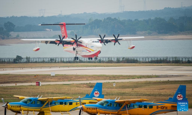 An AG600M firefighting aircraft lands at Zhanghe Airport during a gathering and dropping water test in Jingmen, central China's Hubei Province, Sept. 27, 2022. Codenamed Kunlong, the AG600 large amphibious aircraft family is seen as key aeronautical equipment for China's emergency-rescue system. It was developed by the Aviation Industry Corporation of China (AVIC), the country's leading plane-maker, to meet the needs of firefighting and marine-rescue missions, as well as other critical emergency-rescue operations.(Photo: Xinhua)