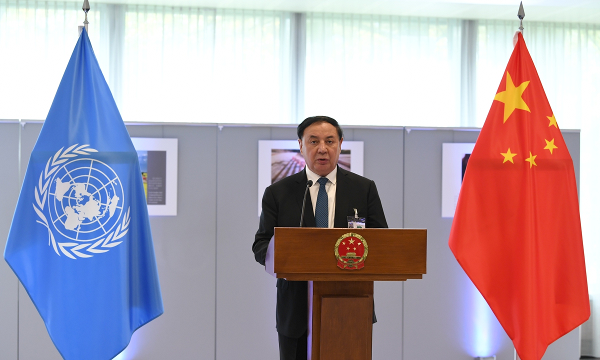Shewket Imin, director of the Standing Committee of the People's Congress of Xinjiang Uygur Autonomous Region, delivers a speech at the ceremony of the photo exhibition entitled 