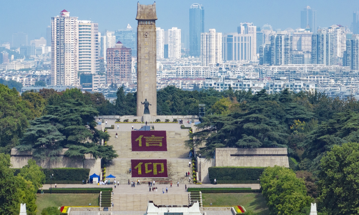 Tens of thousands of pots of flowers form the word 