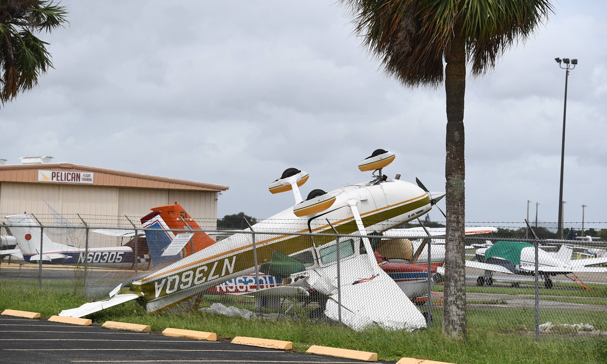 Small aircraft are seen flipped upside-down after a reported tornado touches down at North Perry Airport as Hurricane Ian approaches on September 28, 2022 in Pembroke Pines, Florida. Photo: VCG