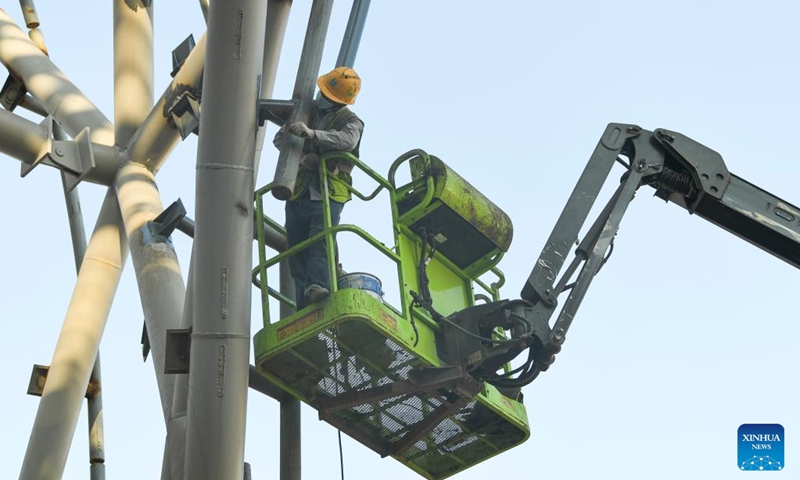 A worker works at the construction site of a youth activity center in southwest China's Chongqing Municipality, Sept. 29, 2022. The construction of a youth activity center, covering an area of about 150 mu (10 hectares), went smoothly in Chongqing. (Xinhua/Wang Quanchao)