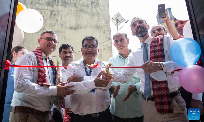 The United Nations Development Program (UNDP) Nepal's Deputy Representative Bernardo Cocco (1st R, front) inaugurates the China-funded waste treatment center in Narayani Hospital in Birgunj, Nepal, Sept. 29, 2022. Narayani Hospital in Nepal's southern city of Birgunj has its own health care waste treatment center now, bringing much relief to those inside and around the health facility.(Photo by Hari Maharjan/Xinhua)