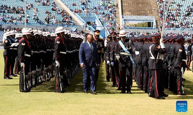 Botswanan President Mokgweetsi Masisi (C, Front) inspects a guard of honor during the Independence Day celebration in Gaborone, Botswana, on Sept. 30, 2022. Botswana on Friday celebrated the 56th anniversary of its independence. (Photo by Tshekiso Tebalo/Xinhua)