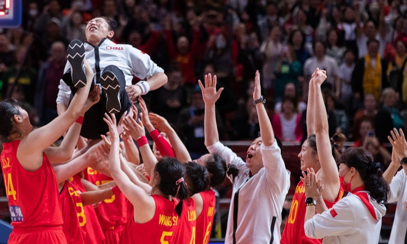 Players of China lift their head coach Zheng Wei (Top) after winning the semifinal match against Australia at Women's basketball World cup 2022 in Sydney, Australia, Sept. 30, 2022. (Photo by Hu Jingchen/Xinhua)