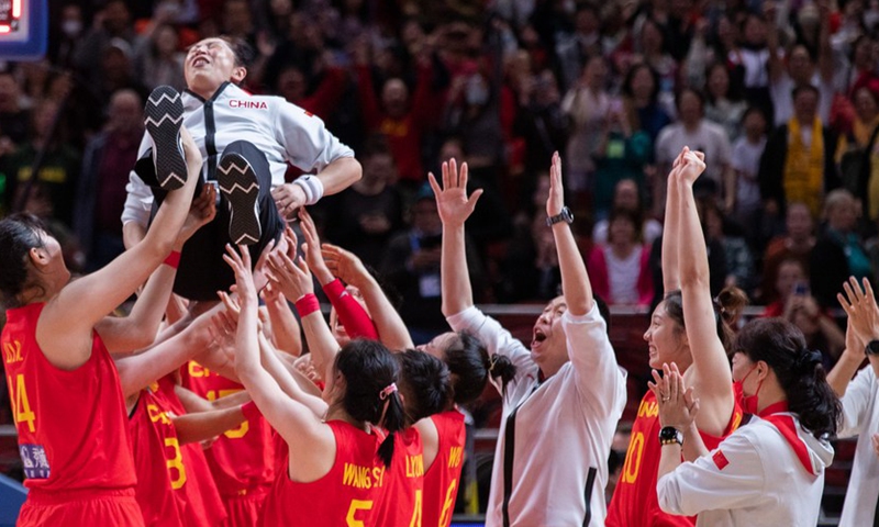 Players of China lift their head coach Zheng Wei (Top) after winning the semifinal match against Australia at Women's basketball World cup 2022 in Sydney, Australia, Sept. 30, 2022. (Photo by Hu Jingchen/Xinhua)