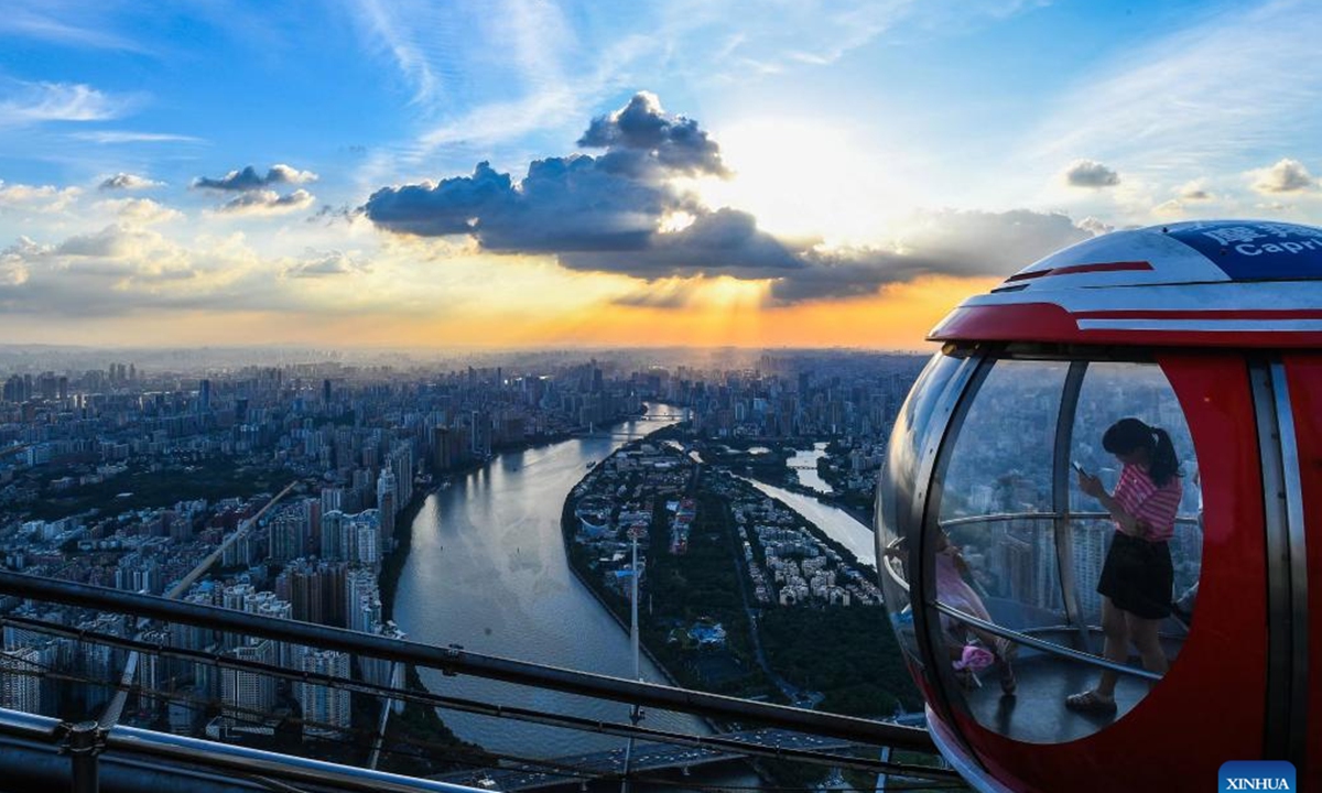 Photo taken at the top of the Canton Tower, a landmark in Guangzhou, on Aug. 7, 2022 shows the Pearl River running through downtown of Guangzhou, capital of south China's Guangdong Province. (Xinhua/Liu Dawei)