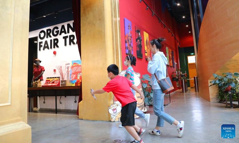 People visit Zotter Chocolate Theatre in Shanghai, east China, Sept. 24, 2022. Since participating in the first China International Import Expo (CIIE) in 2018, Austrian Zotter Chocolate has been expanding its sales network in the Chinese market, bringing new chocolate-making skills and concepts. In the upcoming 5th CIIE, Zotter Chocolate will expand the booth area and bring more brand new chocolate flavors. Photo: Xinhua