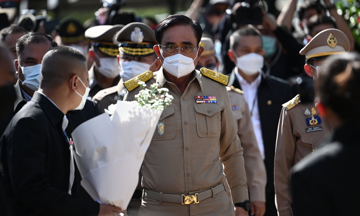 Thai Prime Minister Prayut Chan-o-cha (C) arrives on October 7, 2022 to meet relatives gathered outside the
nursery, where a former police officer killed at least 37 people in a mass shooting, in Thailand's northeastern Nong
Bua Lam Phu province. Photo: VCG