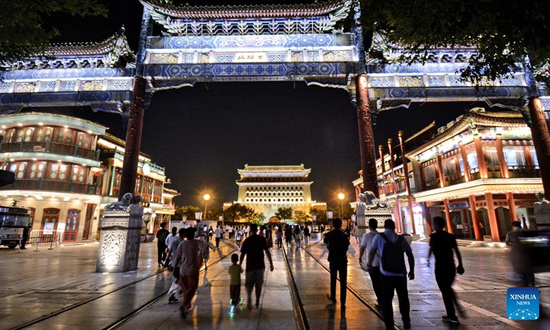 Citizens visit Qianmen Street, a landmark commercial street in Beijing, capital of China, July 6, 2022.Photo:Xinhua