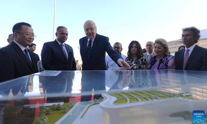 Lebanese Prime Minister Najib Mikati (3rd L) looks at the model of China-funded National Higher Conservatory of Music during his visit to the construction site of the conservatory in Dbayeh, near Beirut, Lebanon, Oct. 6, 2022.Photo:Xinhua