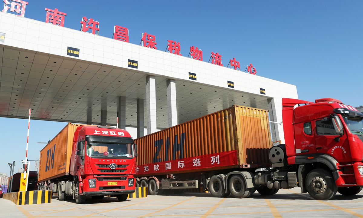 Cargo trucks depart from a logistics park in Xuchang, Central China's Henan Province. Photo: cnsphotos
