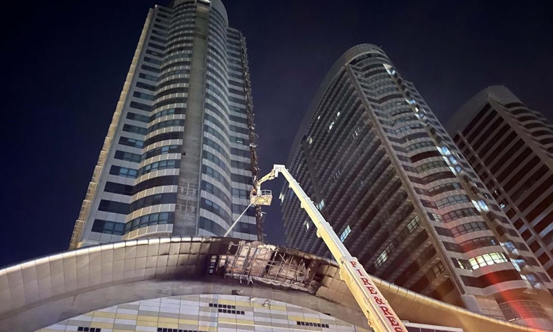 A firefighter works at the site of a fire that broke out on a prime building in Islamabad, capital of Pakistan, Oct. 9, 2022. A fire erupted in the Pakistani capital Islamabad's Centaurus, a prime building consisting of a major shopping mall and elite residential apartments, on Sunday afternoon, officials and police sources said.(Photo: Xinhua)