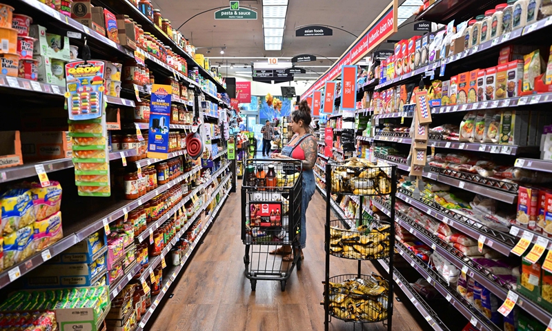 A woman shops for groceries at a supermarket in Monterey Park, California on October 19, 2022. Food prices in September rose 13 percent over last year, according to data released by the US government, as inflation raises prices to its highest levels in decades. Photo: VCG