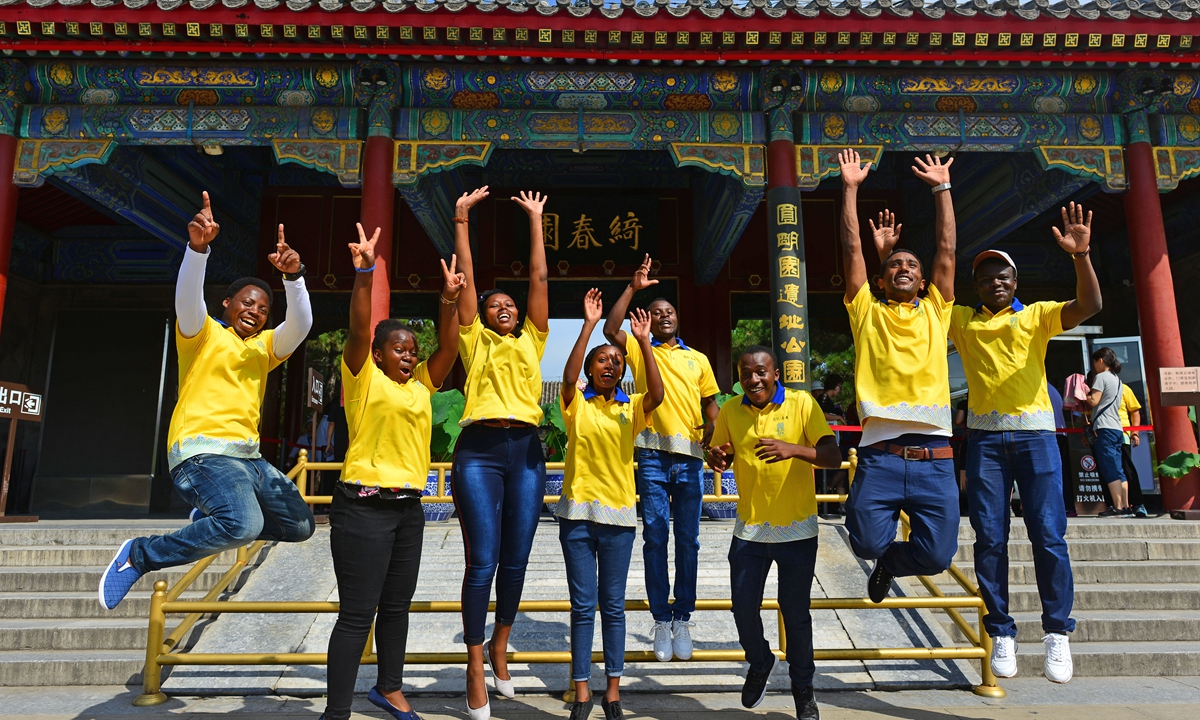 African students join a volunteer team at Yuanmingyuan Park in Beijing in August 2018. Photo: VCG