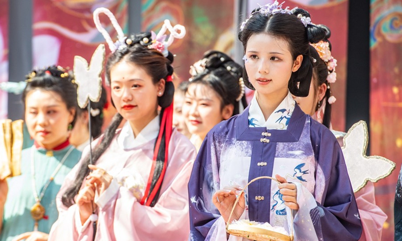 Women present Hanfu, a type of traditional Chinese style garment, in Ciqikou ancient town, southwest China's Chongqing Municipality, Oct. 2, 2022.(Photo: Xinhua)