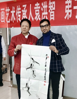 Arif Mughal (right) attends a cultural event in China. Photo: Courtesry of Mughal