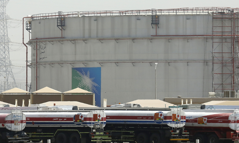 Fuel trucks line up in front of storage tanks at the North Jiddah bulk plant, an Aramco oil facility, in Jiddah, Saudi Arabia, on March 21, 2021. File Photo: VCG