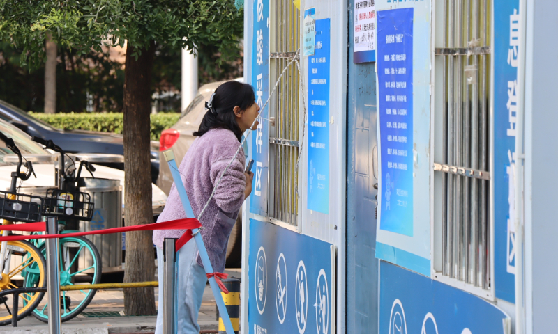 A resident takes nucleic acid testing in Haidian district in Beijing on October 7, 2022. Photo: VCG