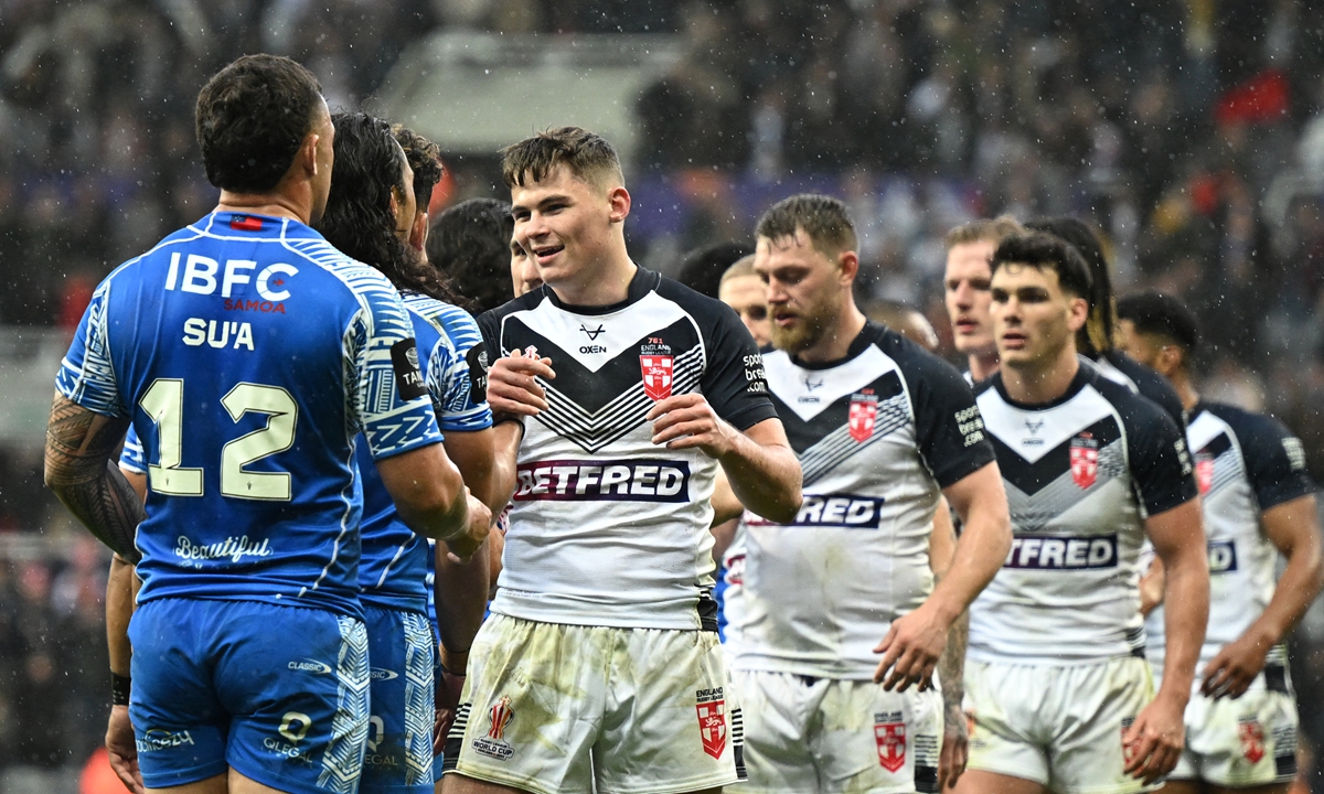Both teams congratulate each other at the end of the Rugby League World Cup men’s Round 1 match between England and Samoa at St. James’ Park in Newcastle, England on October 15, 2022. Photo: AFP