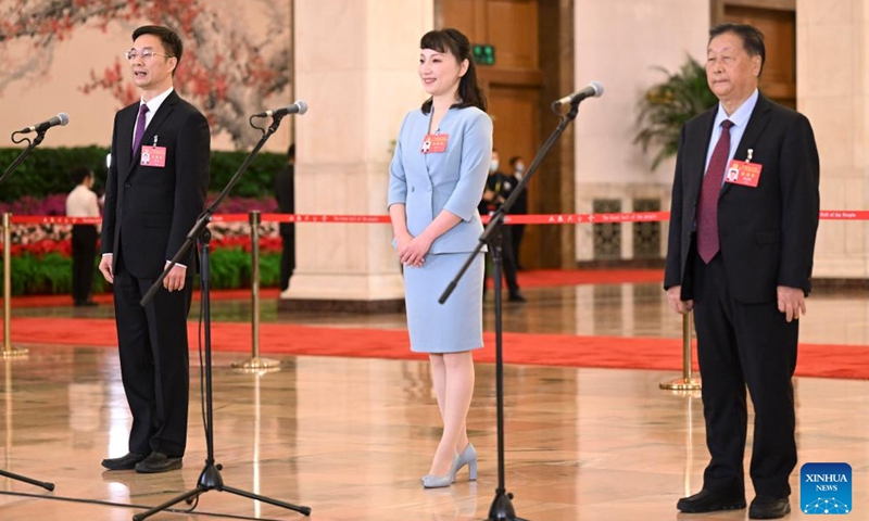 Delegates to the 20th National Congress of the Communist Party of China (CPC) Zhou Wei, Yang Yu and Lin Zhanxi (from L to R), attend an interview at the Great Hall of the People in Beijing, capital of China, Oct. 16, 2022.Photo:Xinhua