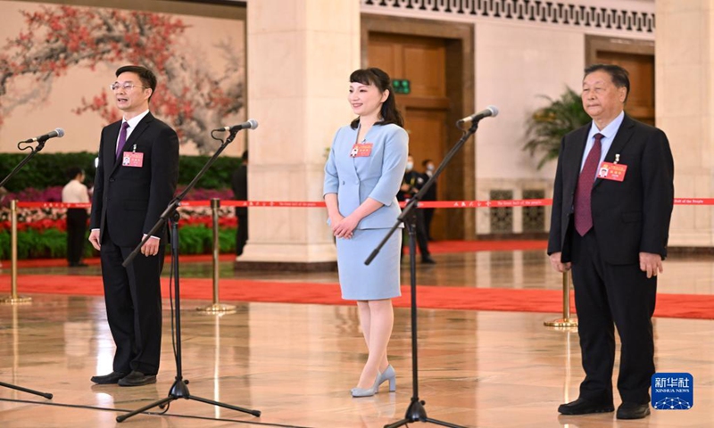 Zhou Wei (left), a delegate to the 20th National Congress of the Communist Party of China, speaks to reporters in Beijing on October 16, 2022. Photo: Xinhua 