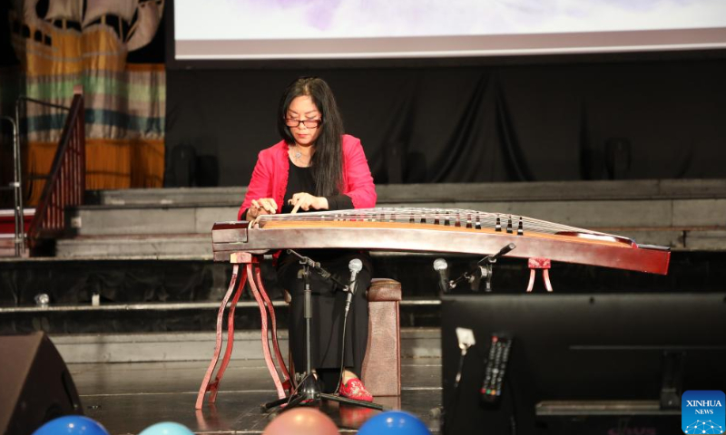 A performer plays guzheng, a traditional Chinese musical instrument, at an event marking the 15th anniversary of the Confucius Institute at University College Cork at the Cork City Hall in Cork, Ireland, Oct. 21, 2022. Photo: Xinhua