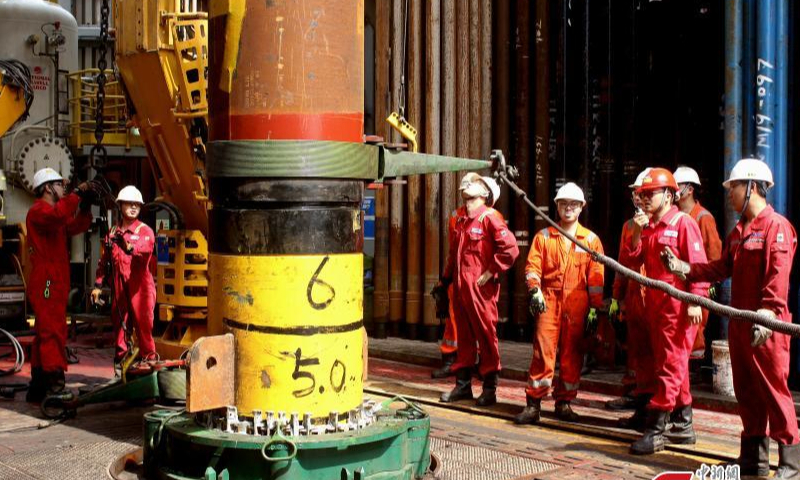 Staff members work at the Hai Yang Shi You (Offshore Oil) 982 at the Baodao 21-1 gas field, the first deep-water deep-stratum large gas field in the South China Sea, Oct. 20, 2022. Photo provided to China News Service