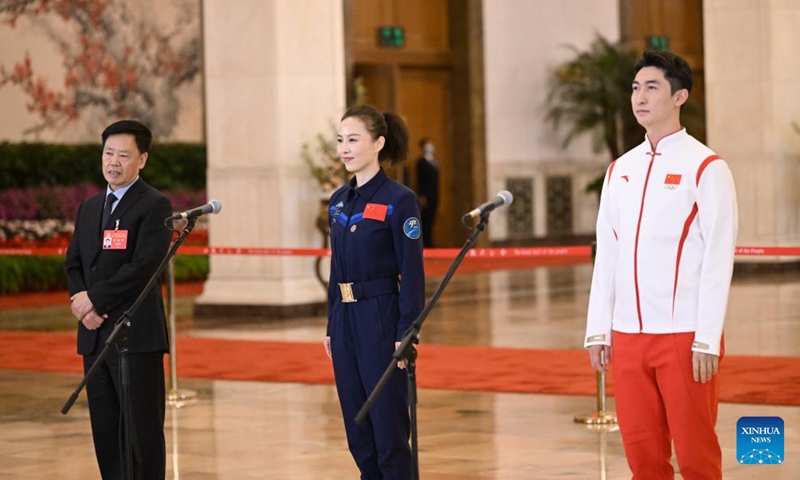 Delegates to the 20th National Congress of the Communist Party of China (CPC) Zhu Youyong, Wang Yaping and Wu Dajing (from L to R), attend an interview at the Great Hall of the People in Beijing, capital of China, Oct. 16, 2022.Photo:Xinhua