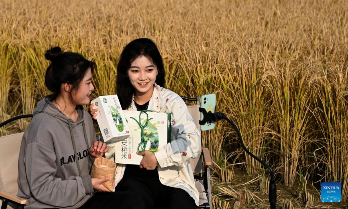Livestreamers sell local rice through live-streaming platform in Huangfu Village, Chang'an District of Xi'an City, northwest China's Shaanxi Province, Oct 21, 2022. In recent years, Chang'an District develops ecological paddy fields and combines paddy rice industry with tourism, which improves the quality of local paddy rice and local economy. Photo:Xinhua