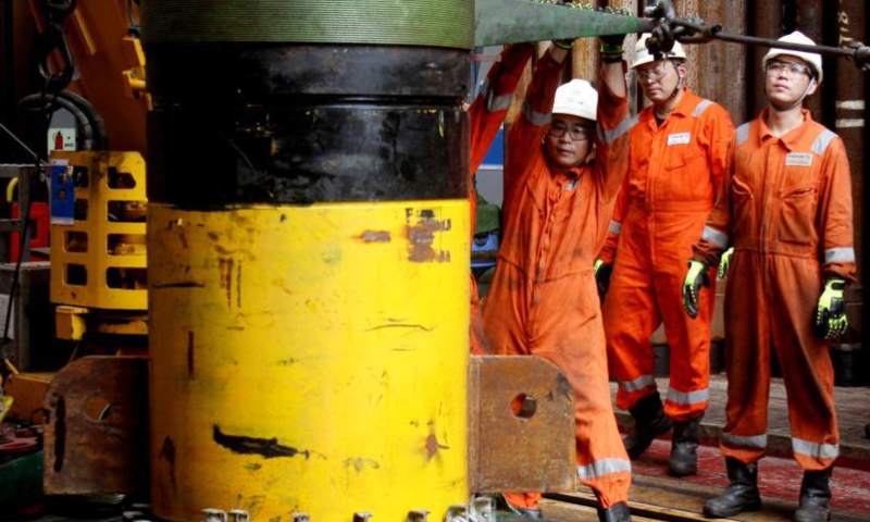 Staff members work at the Hai Yang Shi You (Offshore Oil) 982 at the Baodao 21-1 gas field, the first deep-water deep-stratum large gas field in the South China Sea, Oct. 20, 2022. Photo provided to China News Service